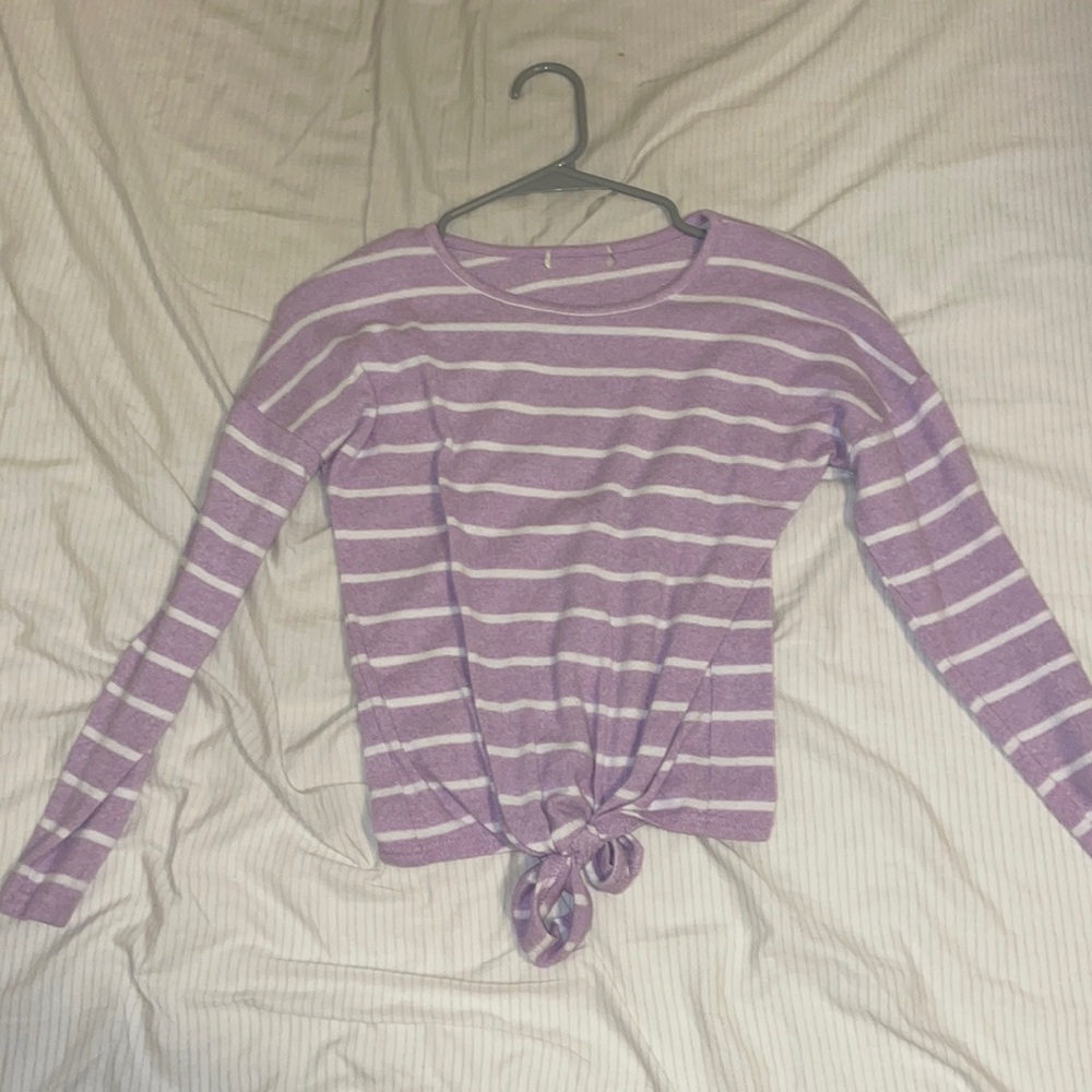 A purple sweater with white strips. It does have a hole in the collar.